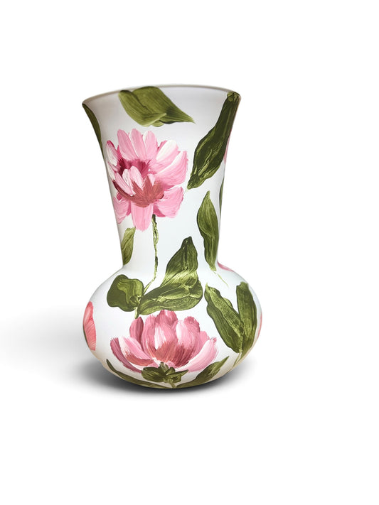 White Vase with Pink flowers and green leaves